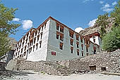 Ladakh - Hemis Gompa, the main monastery halls with the characteristc red painted windows and woden balconies on white washed faades 